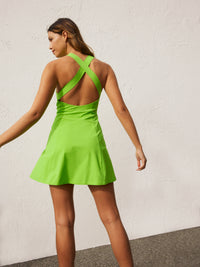 a woman wearing a green dress