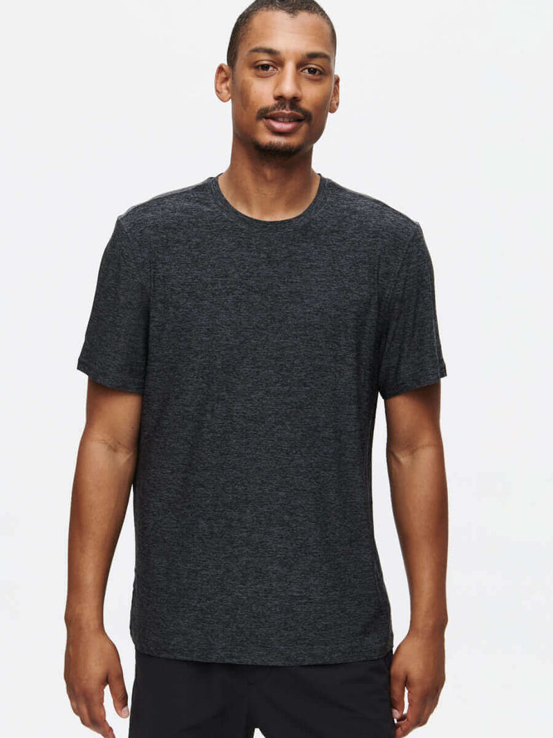 Model wearing CloudKnit Shortsleeve in Dark Heather, super soft and lightweight for everyday wear.