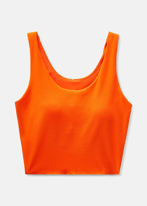 a person wearing an orange tank top