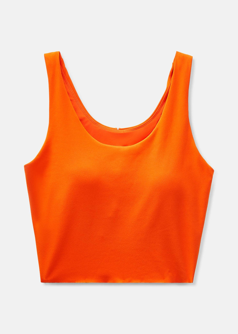 a person wearing an orange tank top