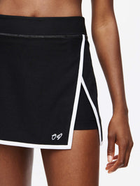 Court Skort 2.5" with signature inner leg silicone gripper band and embroidered hemline, perfect for active wear.