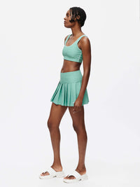 Doing Things 3" Skort displayed on a model wearing a matching crop top in a light green color.