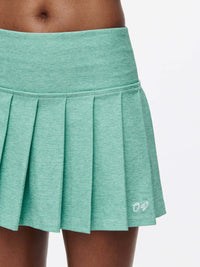 A close-up of the Doing Things 3" Skort showcasing its pleated design and textured compression fabric.