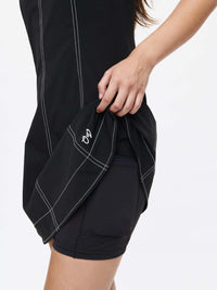 Close-up of the Energy Dress showcasing built-in shorts and contrast topstitching for dynamic movement.