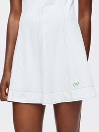 Energy Dress featuring built-in shorts and A-line silhouette with green contrast stitching.