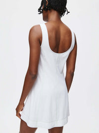 Back view of the stylish Energy Dress showcasing its A-line silhouette and contrast topstitching.