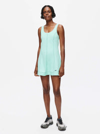 Model wearing the Energy Dress in mint green, showcasing its A-line silhouette and breathable LightSpeed fabric.