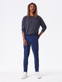 a person wearing a pair of navy pants