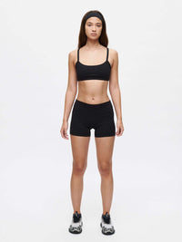 Model wearing Gemini 3" Short and sports bra, showcasing the comfort and style of outdoor activewear.