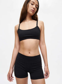 Girl wearing a black top and Gemini 3" Short, showcasing a stylish athletic look with a comfortable fit.
