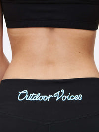 Close-up of back waistband featuring Outdoor Voices logo on Gemini 3" Short, showcasing signature silicone gripper band.