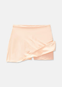 a person wearing a light pink skort