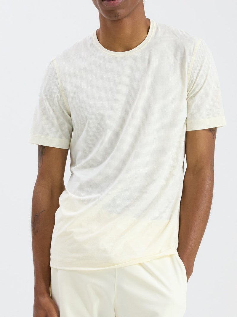 a person wearing a cream shirt