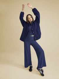 a person wearing a navy jacket
