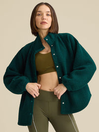 a person wearing a green jacket