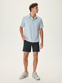 a person wearing a light blue shirt