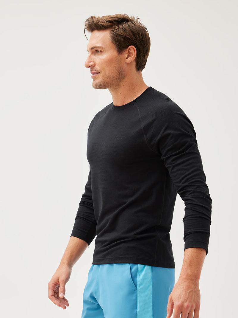 a person wearing a black longsleeve