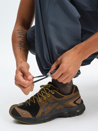 Men's RecTrek Cargo Pant in Dark Storm – close-up of cinchable hem
