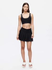 Model wearing the Orbit Bra featuring soft-fit elastic band and contrast stitch detailing.