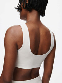Orbit Bra showcased from the back, highlighting soft-fit elastic band and sleek design in textured compression fabric.