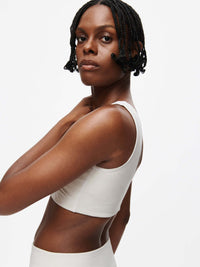 Orbit Bra on model showcasing its soft-fit elastic band and stylish design with OV logo.