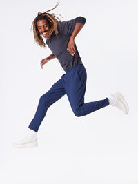 a person wearing a pair of navy pants