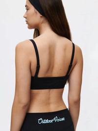 Woman wearing a Solar Bra, showcasing adjustable straps and soft elastic band from the back.