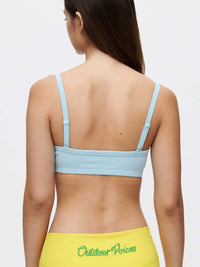 Back view of Solar Bra in blue, showcasing adjustable straps and soft elastic band for comfort.