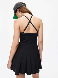 Sporty Dress featuring a dual-fabric design, adjustable straps, and a chic pleated skirt.