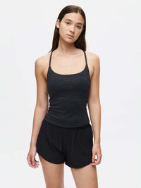 TechSweat Move Free Tank in black worn with shorts, ideal for active workouts and comfort.