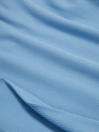 Close-up of soft ribbed fabric in light blue, showcasing the texture of the SuperForm Rib Longsleeve.