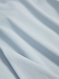 Close-up of soft, ribbed fabric in light blue, showcasing the SuperForm Rib Longsleeve texture.