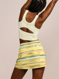 a person wearing a light yellow tank top