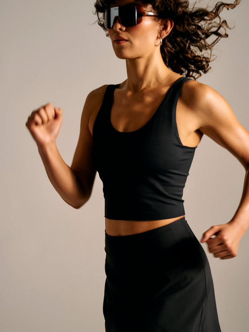 a person wearing a black tank top
