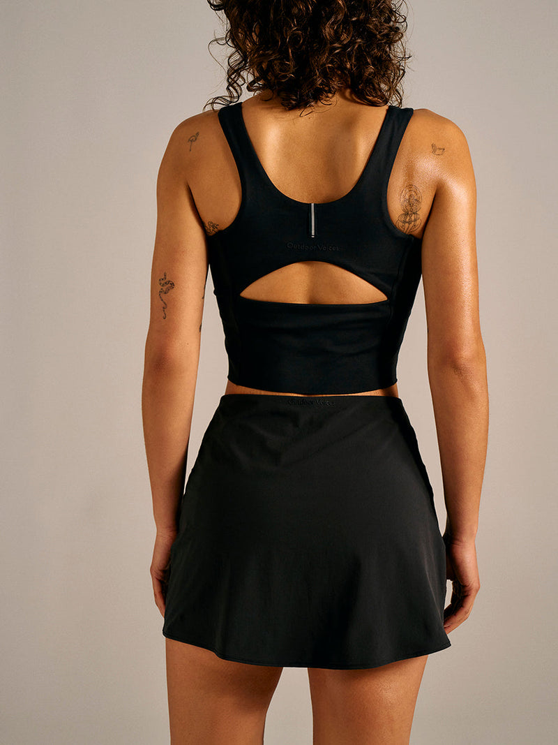 a person wearing a black skort