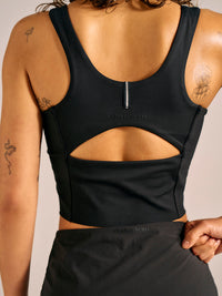a person wearing a black tank top