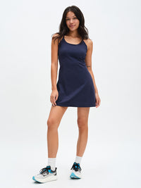 The Exercise Dress in Navy – front full-length view with sneakers