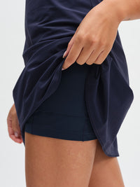 The Exercise Dress in Navy – close-up of built-in shorts under the skirt