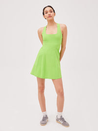 a woman wearing a green dress