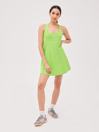 a woman wearing a green dress
