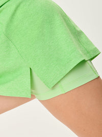 a person wearing a green dress