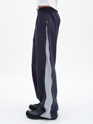 RecTrek Zip Pant in Indigo Multi – side view showing contrast side panel