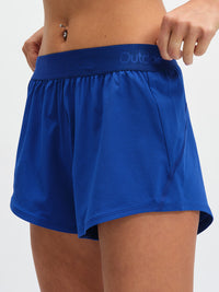 Relay 3" Short in OV Blue – front close-up of logo waistband