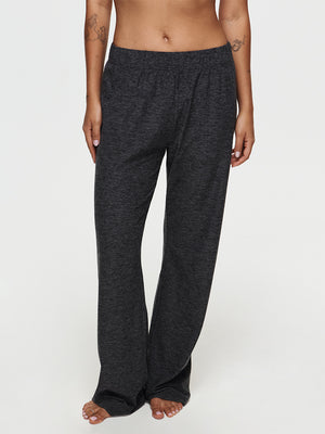 Model standing in CloudKnit Wide Leg Pant in Black, soft and lightweight fabric for maximum comfort.