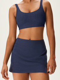 a person wearing a navy skort