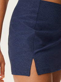 a person wearing a navy skort