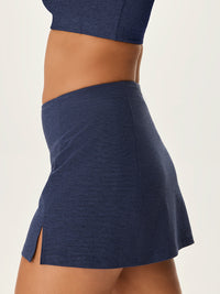 a person wearing a navy skort