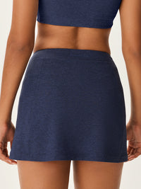 a person wearing a navy skort