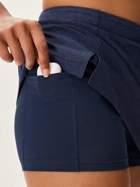 a person wearing a navy skort