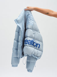 Gloss Puffer in Baby – held up to show back graphic